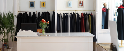 Capes hanging in store from Capas Sesena | Planet case study